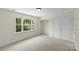 Bright bedroom features a large window and closet space, offering comfort and storage at 1500 Lynway Dr, Charlotte, NC 28203