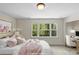 Staged bedroom with natural light and cozy decor; creating an inviting, comfortable space at 1500 Lynway Dr, Charlotte, NC 28203
