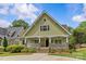 Charming craftsman home with a welcoming front porch, stone accents, and well-manicured landscaping at 1500 Lynway Dr, Charlotte, NC 28203