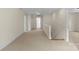 Spacious hallway with neutral carpeting, white trim, and access to multiple rooms at 1500 Lynway Dr, Charlotte, NC 28203