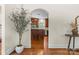 Open view of a kitchen with dark wood cabinets, stainless appliances and open doorway at 1500 Lynway Dr, Charlotte, NC 28203