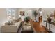 Open-concept living room with hardwood floors, stylish decor, and a cozy seating area at 1500 Lynway Dr, Charlotte, NC 28203