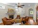Comfortable living room with a fireplace, hardwood floors, and cozy seating arrangement at 1500 Lynway Dr, Charlotte, NC 28203