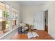Bright office featuring a large window, hardwood floors, and a view of the front porch at 1500 Lynway Dr, Charlotte, NC 28203