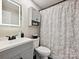 Cozy bathroom featuring an LED mirror, vanity, toilet, and patterned shower curtain at 1505 Wimbleton Woods Dr # 5, Fort Mill, SC 29708
