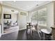 Sunlit breakfast nook features a small table and chairs next to a large window with views at 1505 Wimbleton Woods Dr # 5, Fort Mill, SC 29708