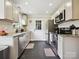 Modern kitchen featuring stainless steel appliances, granite countertops, and ample cabinet space at 1505 Wimbleton Woods Dr # 5, Fort Mill, SC 29708