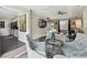Open living room with staircase, ceiling fan, dining area, and views into kitchen at 1505 Wimbleton Woods Dr # 5, Fort Mill, SC 29708