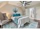 Comfortable main bedroom with ceiling fan, wood floors, and cozy seating area at 1505 Wimbleton Woods Dr # 5, Fort Mill, SC 29708