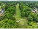 Scenic aerial view of a golf course, showcasing lush greenery and beautiful landscaping at 15737 Agincourt Dr, Huntersville, NC 28078