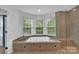 Bathroom featuring a jetted tub, glass shower, and natural light from multiple windows at 15737 Agincourt Dr, Huntersville, NC 28078