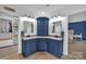 Bathroom featuring a double sink vanity, overhead lighting, and a custom mirror at 15737 Agincourt Dr, Huntersville, NC 28078