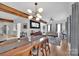 Open-concept dining area with a wooden table, stylish chairs, and access to the living room at 15737 Agincourt Dr, Huntersville, NC 28078