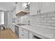 Beautiful kitchen featuring white subway tile, quartz counters, and a modern range hood at 15737 Agincourt Dr, Huntersville, NC 28078