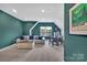 Bright and airy living area features a comfortable sofa, round table, and a large window with natural light at 15737 Agincourt Dr, Huntersville, NC 28078