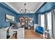 Stylish home office featuring custom bookshelves, modern lighting, and a comfortable work space at 15737 Agincourt Dr, Huntersville, NC 28078