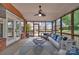 Relaxing screened porch with comfortable seating, ceiling fan, and stylish rug provides an inviting outdoor space at 15737 Agincourt Dr, Huntersville, NC 28078