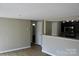 Living area features an open layout and view into the updated kitchen with granite countertops at 1604 Arlyn Cir # E, Charlotte, NC 28213