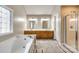 Primary bathroom with double vanity, soaking tub, and walk-in shower at 1648 Jonesberry Dr, Rock Hill, SC 29732