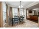 Cozy dining area with tiled floors, natural light, and a view into the adjacent living room at 1648 Jonesberry Dr, Rock Hill, SC 29732