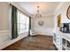Inviting dining area with hardwood floors, accent chair, and modern lighting at 1648 Jonesberry Dr, Rock Hill, SC 29732