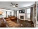 Open-concept living room with hardwood floors, a fireplace, and large windows for natural light at 1648 Jonesberry Dr, Rock Hill, SC 29732