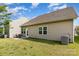 Backyard with patio, well-maintained lawn, and outdoor seating - perfect for relaxing and entertaining at 1659 Loggerhead Dr, Lancaster, SC 29720