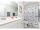 Well-lit bathroom with a double sink vanity and shower-tub combination at 1659 Loggerhead Dr, Lancaster, SC 29720