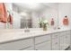 Bright bathroom featuring a double vanity, large mirror, and modern fixtures at 1659 Loggerhead Dr, Lancaster, SC 29720