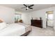 Spacious bedroom featuring a ceiling fan, ensuite bathroom, and neutral decor for a calming and comfortable space at 1659 Loggerhead Dr, Lancaster, SC 29720