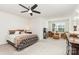 Bedroom with a ceiling fan, a sitting area near the window, and comfortable furniture to enjoy the spacious area at 1659 Loggerhead Dr, Lancaster, SC 29720