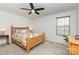 Bright bedroom with neutral carpet and a large window allowing natural light at 1659 Loggerhead Dr, Lancaster, SC 29720