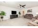 Open living room with large TV, ceiling fan, and comfortable seating at 1659 Loggerhead Dr, Lancaster, SC 29720