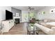 Comfortable living room with a fireplace, large windows and outdoor access to backyard at 1659 Loggerhead Dr, Lancaster, SC 29720