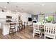 Open-concept kitchen and living space with granite counters and dining area at 1659 Loggerhead Dr, Lancaster, SC 29720