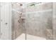Modern tile shower with glass door and a built-in seat is the perfect spa retreat at 1659 Loggerhead Dr, Lancaster, SC 29720