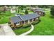 Charming brick home aerial view with landscaped front yard and walkway at 1735 Hollandale Dr, Gastonia, NC 28054