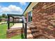 This home features a charming brick patio with a black railing at 1735 Hollandale Dr, Gastonia, NC 28054