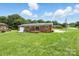 Expansive backyard view of the home with brick exterior and sliding door at 1735 Hollandale Dr, Gastonia, NC 28054