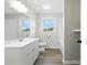 Beautifully renovated bathroom with new vanity, fixtures, and stylish tile work at 1735 Hollandale Dr, Gastonia, NC 28054