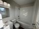 Bathroom featuring subway tile backsplash, tub, vanity, and sink at 1735 Hollandale Dr, Gastonia, NC 28054