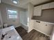 Updated bathroom featuring a modern vanity, bright lighting, and a combination tub and shower with white subway tile at 1735 Hollandale Dr, Gastonia, NC 28054