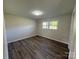Cozy bedroom with a neutral palette, ample natural light, and modern flooring, creating a serene atmosphere at 1735 Hollandale Dr, Gastonia, NC 28054