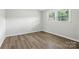 Cozy bedroom featuring fresh paint, modern flooring, and ample natural light at 1735 Hollandale Dr, Gastonia, NC 28054