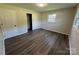 Bedroom featuring wood-look floors, closet, natural light and neutral walls at 1735 Hollandale Dr, Gastonia, NC 28054