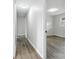 Hallway featuring modern flooring that leads to the living spaces at 1735 Hollandale Dr, Gastonia, NC 28054