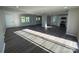 Open-concept living space featuring modern flooring, natural light, and a seamless flow to the kitchen area at 1735 Hollandale Dr, Gastonia, NC 28054