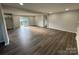 Spacious living room featuring new flooring, neutral walls, recessed lighting, and sliding glass door at 1735 Hollandale Dr, Gastonia, NC 28054