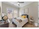 Cozy bedroom featuring a bed with decorative pillows and a nightstand with a lamp at 19004 Dry Narrows Way, Charlotte, NC 28278