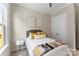 Comfortable bedroom featuring neutral tones, soft bedding, and closet with double doors at 19004 Dry Narrows Way, Charlotte, NC 28278